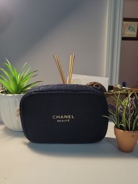 CHANEL Black Cosmetic Pouch with Gold Logo